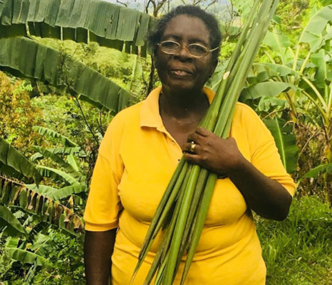 Artisan holding locally sourced natural fibers