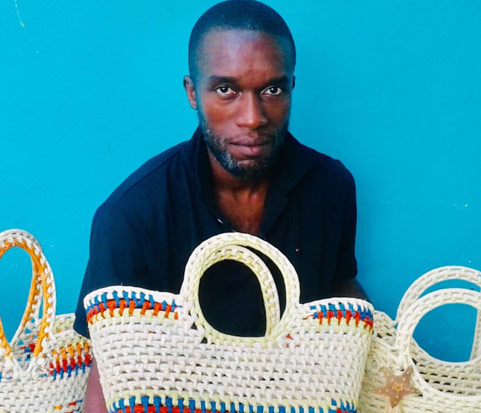 Artisan with handwoven bags